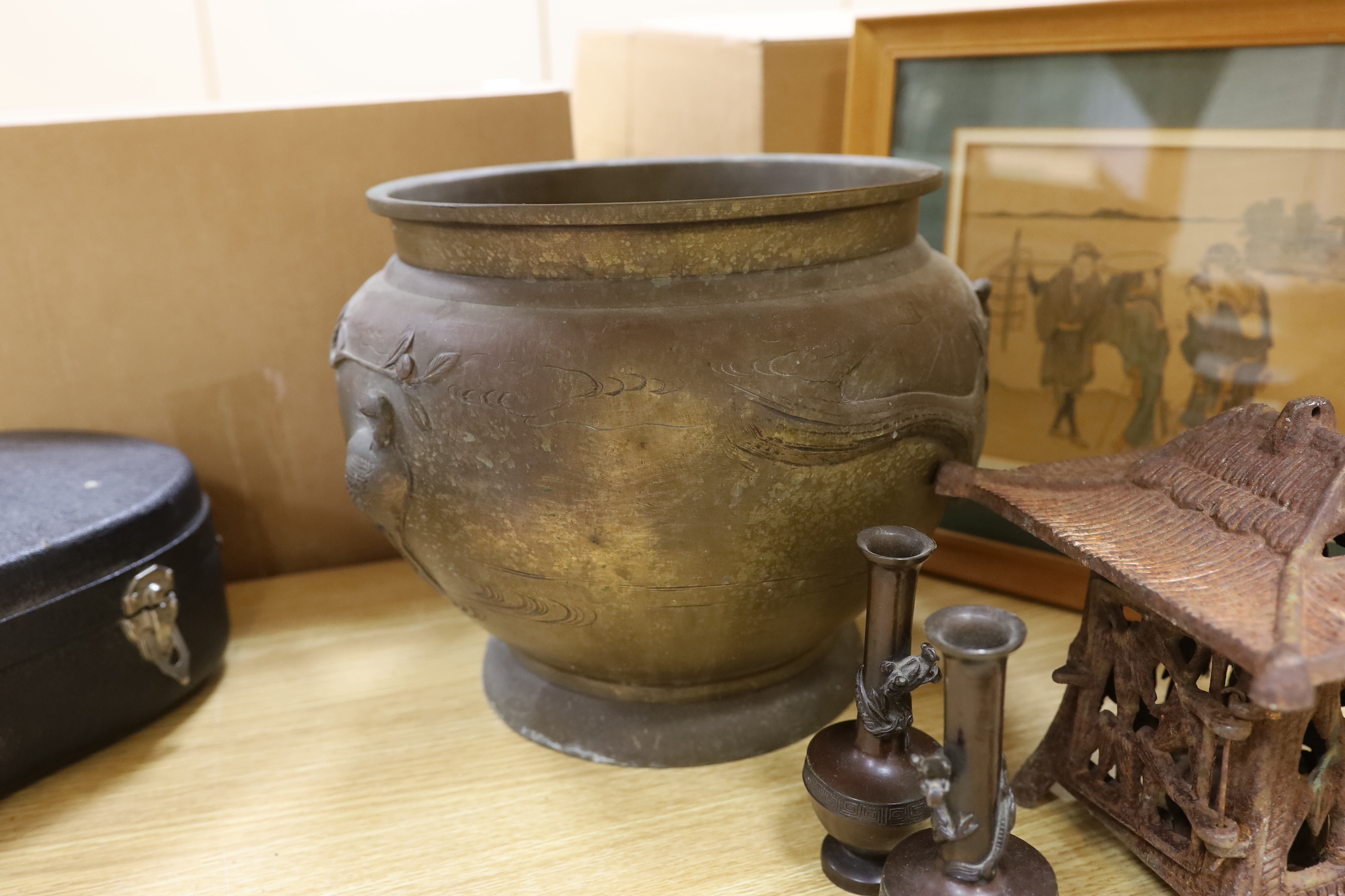 A Japanese bronze jardiniere, a similar pair of small bottle vases, a Japanese cast-iron lantern, a Japanese print, and a Chinese silver model of a rickshaw